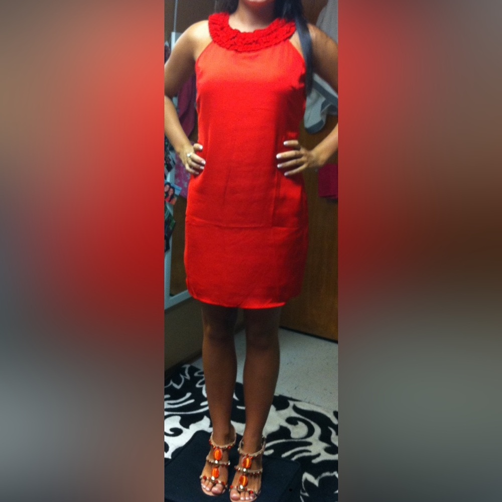 Women size small beautiful red dress, hits at the knee and is fitted.